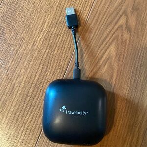Travelocity Over the Ear- Ear Buds with rechargeable Station